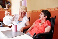 woman and carer pouring tea